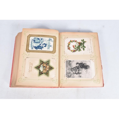 240 - POSTCARDS, two albums containing approximately 417* early 20th century CHRISTMAS Postcards (Edwardia... 