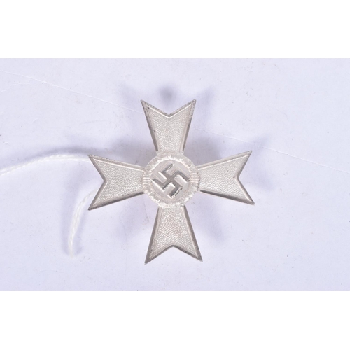 294 - A GERMAN THIRD REICH FIRST CLASS WAR MERIT CROSS WITHOUT SWORDS, this merit cross is silver in colou... 