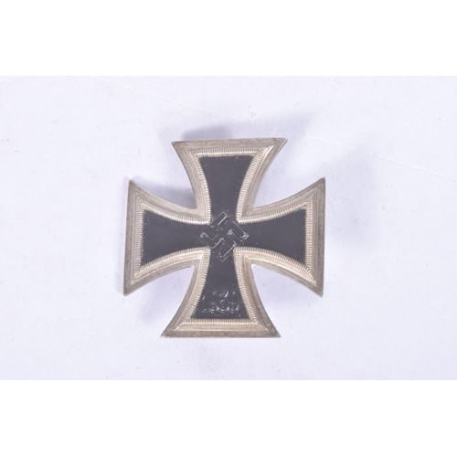 296 - A CASED WWII IRON CROSS FIRST CLASS, THE CROSS ITSELF SHOWS SOME WEAR to the front and back and has ... 