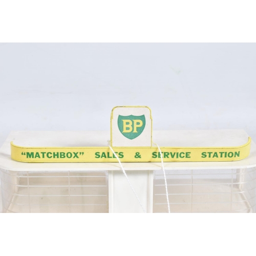 105 - A BOXED MATCHBOX SERVICE STATION, No.MG-1, later BP version with roof sign labels and detailed pictu... 