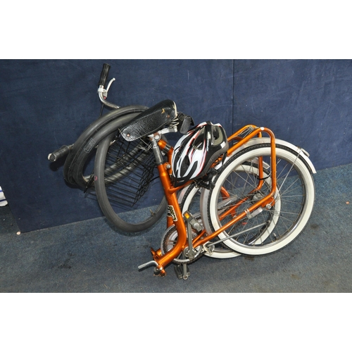 1052 - A HAWKS CYCLE FOLDING BICYCLE with 20in wheels and 16in frame in good condition along with helmet an... 