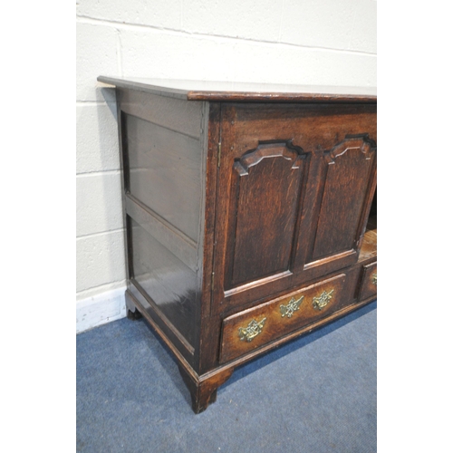 1205 - A GEORGIAN OAK CONVERTED MULE CHEST, with a double fielded panel doors over two drawers on bracket f... 