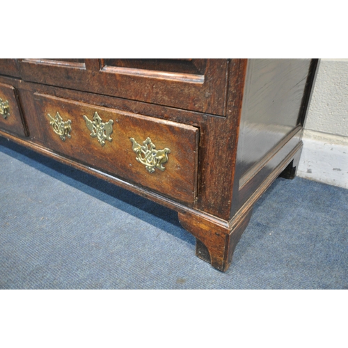 1205 - A GEORGIAN OAK CONVERTED MULE CHEST, with a double fielded panel doors over two drawers on bracket f... 