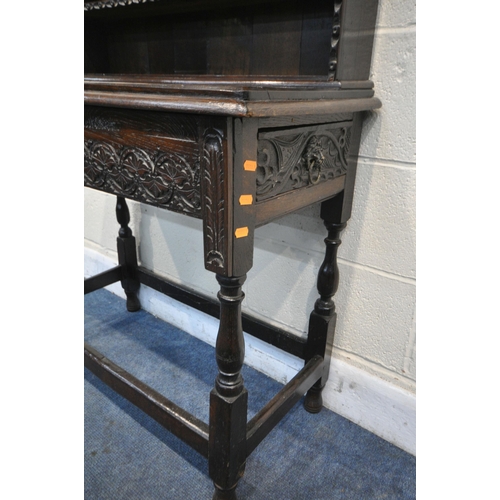 1207 - A OAK DRESSER INCORPORATING 18TH CENTURY OR EARLIER TIMBERS, the oak top with five open shelves over... 