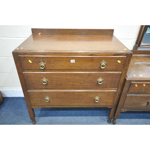 1208 - AN EARLY 20TH CENTURY OAK BEDROOM SUITE, comprising a single mirror door wardrobe width 118cm x dept... 