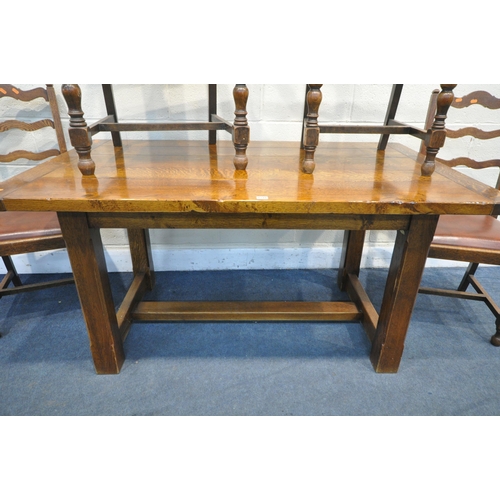 1216 - A REPRODUCTION GEORGIAN STYLE OAK DINING TABLE, on block chamfered legs, united by a floor stretcher... 