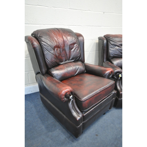 1217 - TWO OXBLOOD LEATHER ARMCHAIRS, one chair manual reclining, width of outer arm 91cm (condition:- mech... 