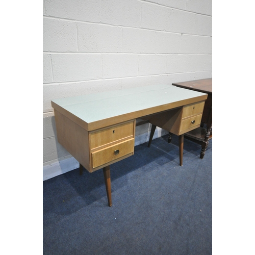 1219 - A MID CENTURY GREEN FORMICA TOPPED AND TEAK DESK, possibly by Ekawerk Horn Lippe of Germany, with fo... 