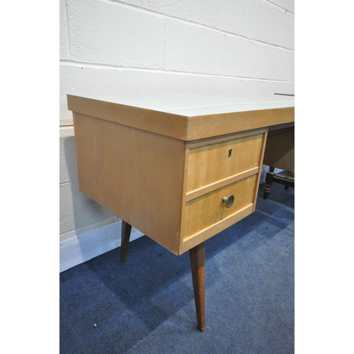 1219 - A MID CENTURY GREEN FORMICA TOPPED AND TEAK DESK, possibly by Ekawerk Horn Lippe of Germany, with fo... 