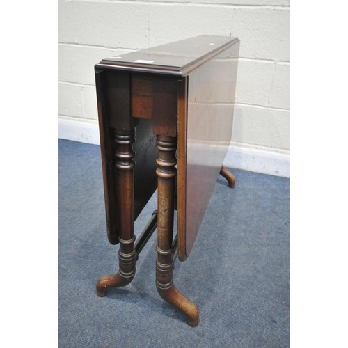 1221 - A VICTORIAN WALNUT SUTHERLAND TABLE, the fold down leaves supported on cylindrical gate leg, open wi... 