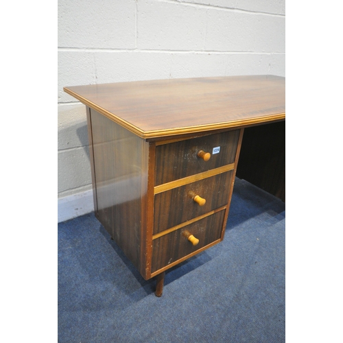 1224 - A MID CENTURY TEAK DESK, possibly Morris of Glasgow, bow front and back top, over six drawers, width... 