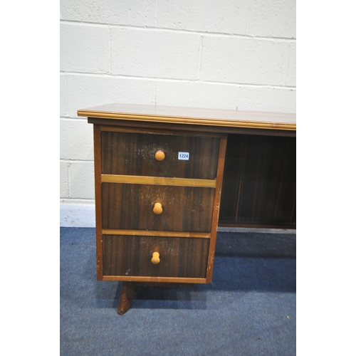 1224 - A MID CENTURY TEAK DESK, possibly Morris of Glasgow, bow front and back top, over six drawers, width... 