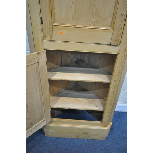 1235 - A VICTORIAN STYLE PINE FARM HOUSE KITCHEN CORNER CUPBOARD, made up of two panelled cupboard doors, w... 