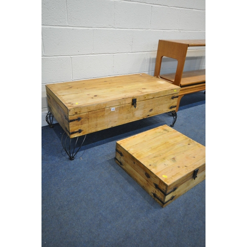 1245 - A PINE STORAGE COFFEE TABLE, on metal shaped legs, width 106cm x depth 60cm x height 42cm, a matchin... 