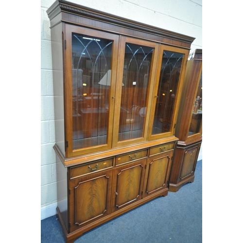 1255 - A MAHOGANY THREE DOOR BOOKCASE, over three cupboard doors width 138cm x depth 40cm x height 194cm, a... 