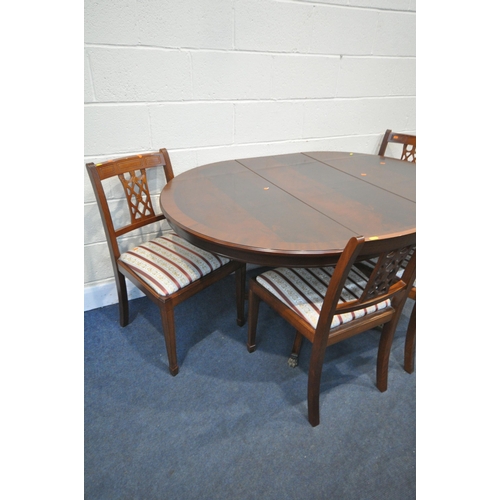 1256 - A MAHOGANY CIRCULAR PEDESTAL DINING TABLE, with a single fold out leaf, extended length 154cm x diam... 