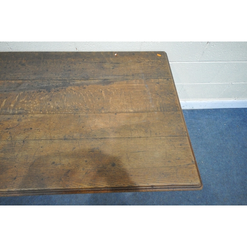 1272 - AN EARLY 20TH CENTURY OAK TABLE, with a plank top, a drawer at each end, on turned legs, length 162c... 