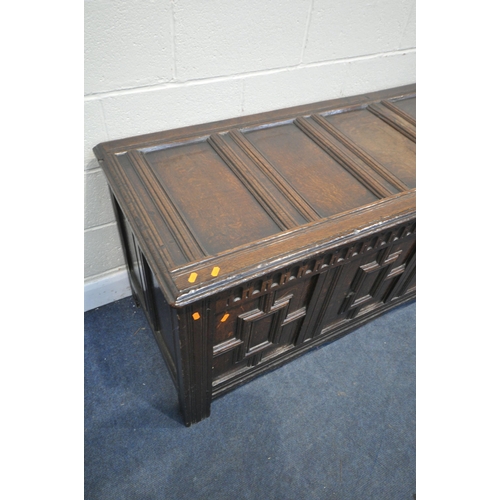 1288 - A LONG GEORGIAN OAK PANEL COFFER, with four Geometric panels, with a hinged storage to the left side... 