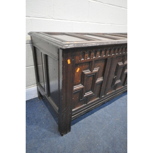 1288 - A LONG GEORGIAN OAK PANEL COFFER, with four Geometric panels, with a hinged storage to the left side... 