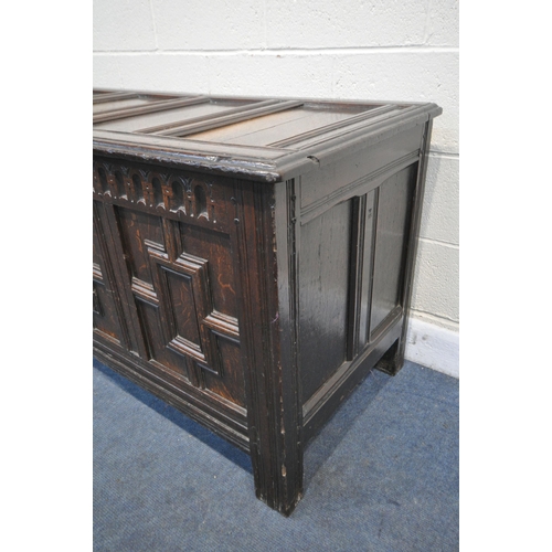 1288 - A LONG GEORGIAN OAK PANEL COFFER, with four Geometric panels, with a hinged storage to the left side... 