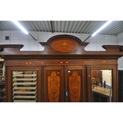 1294 - AN EDWARDIAN MAHOGANY COMPACTUM WARDROBE, with two bevelled mirror doors, flanking two small cupboar... 