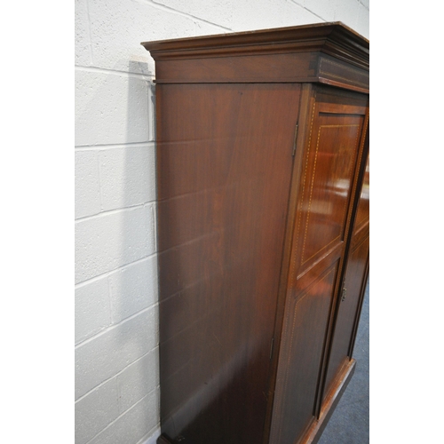 1295 - AN EDWARDIAN MAHOGANY AND INLAID WARDROBE, with overhanging cornice, double doors enclosing an arran... 