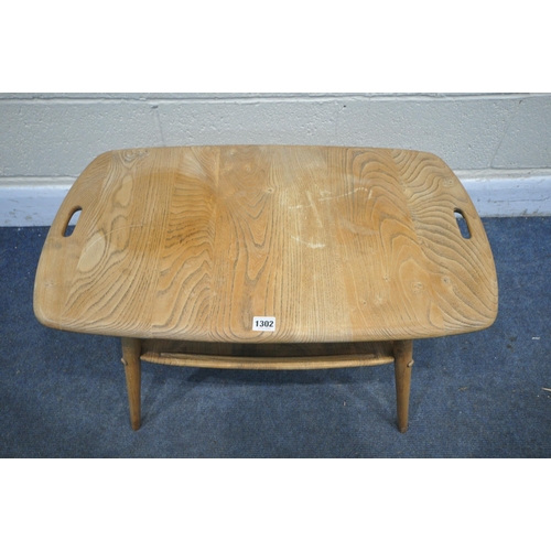 1302 - AN ERCOL ELM TRAY COFFEE TABLE, with twin handles, on cylindrical uprights, and undershelf, width 73... 