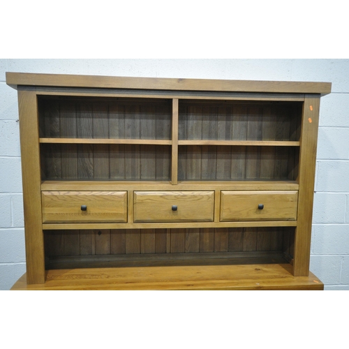 1329 - A SOLID OAK DRESSER, oak furniture land, Hercules Range, with open shelving and draw storage, while ... 