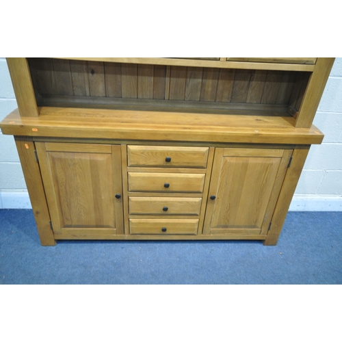 1329 - A SOLID OAK DRESSER, oak furniture land, Hercules Range, with open shelving and draw storage, while ... 