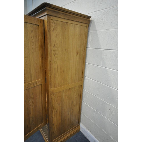 1331 - A SOLID OAK WARDROBE, with two doors over two drawers , width 93cm x depth 60cm x  height 181cm (con... 