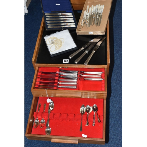 122 - A TEAK TWO DRAWER CANTEEN OF BENNETT & HERON SILVER PLATED CUTLERY, the cabinet with open area and m... 