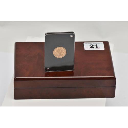 21 - A BOXED 1885 VICTORIA HALF GOLD SOVEREIGN ENCASED IN A PERSPEX SLEEVE, 3.97 grams, 9.16 fine comes i... 