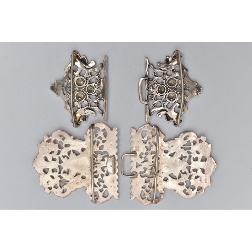 49 - TWO SILVER NURSES BELT BUCKLES, the first a large openwork floral and Bacchus buckle, hallmarked 'Wi... 