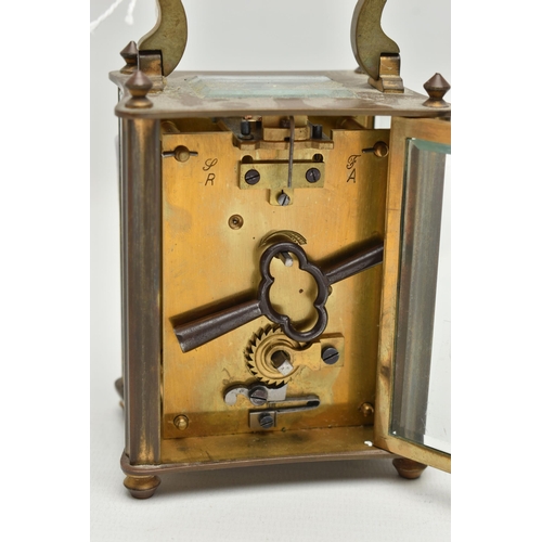 70 - A CARRIAGE CLOCK, white ceramic dial, roman numerals, steel hands (one hand is free from the dial an... 