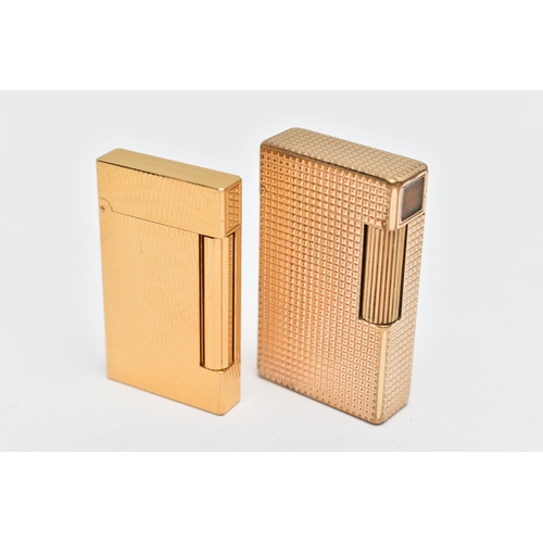 72 - TWO 'S T DUPONT' LIGHTERS, two gold plated rectangular lighters, each signed 'S T Dupont Paris, Made... 