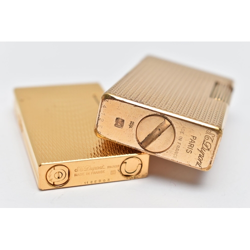 72 - TWO 'S T DUPONT' LIGHTERS, two gold plated rectangular lighters, each signed 'S T Dupont Paris, Made... 