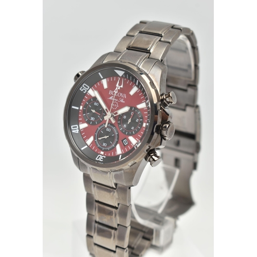 77 - A GENTS 'BULOVA' CHRONOGRAPH WRISTWATCH, quartz movement, round red dial signed 'Bulova Marine Star'... 