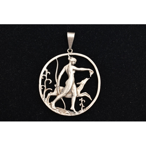 78 - A SILVER OPENWORK PENDANT, depicting goddess Diana bearing a bow walking with a deer, engraved to th... 