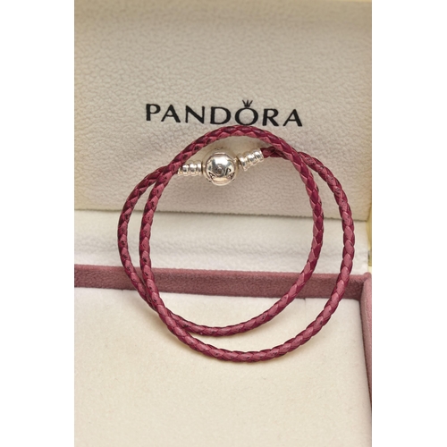 79 - TWO PANDORA BRACELETS AND OTHER ITEMS, to include a boxed pink cord bracelet fitted with a signed 'P... 