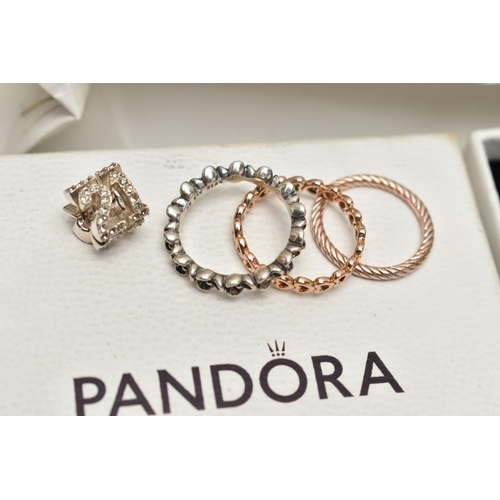 79 - TWO PANDORA BRACELETS AND OTHER ITEMS, to include a boxed pink cord bracelet fitted with a signed 'P... 