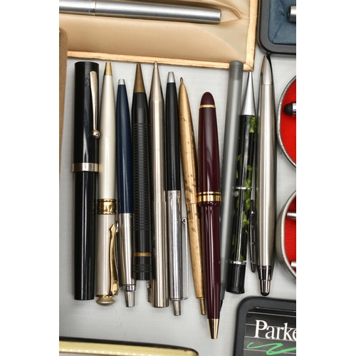 92 - A TIN OF ASSORTED PENS, to include two brushed steel 'Sheaffer' ball point pens with boxes, a boxed ... 