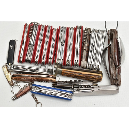 93 - AN ASSORTMENT OF SWISS ARMY KNIVES, twenty knives, predominantly 'Victorinox', (condition report: us... 