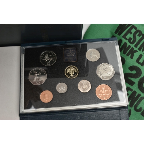 124 - A PLASTIC CASE CONTAINING COIN ALBUMS AND MIXED COINAGE TO INCLUDE:A 1992 Proof Uk and Ireland coin ... 