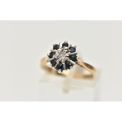 138 - A 9CT GOLD SAPPHIRE AND DIAMOND CLUSTER RING, centring on a single cut diamond illusion set, in a su... 