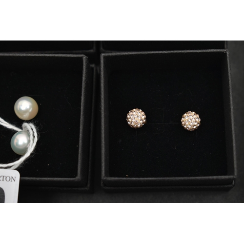 140 - A BOX OF ASSORTED EARRINGS, nine pairs in total, to include seven pairs of cultured pearl stud earri... 