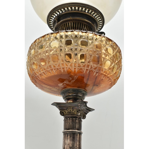 152 - A LATE VICTORIAN / EDWARDIAN SILVER BASED OIL LAMP, with globular etched glass shade and a chimney, ... 