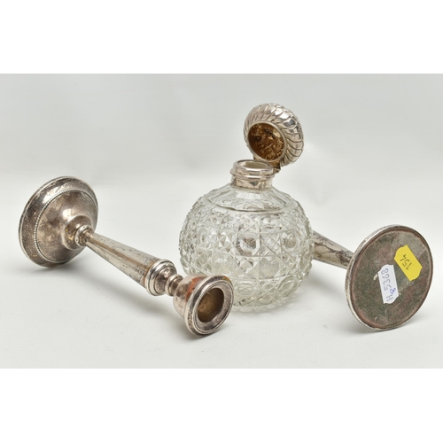 154 - A PAIR OF ELIZABETH II SILVER CANDLESTICKS AND AN EDWARDIAN SILVER MOUNTED GLASS SCENT BOTTLE, the c... 