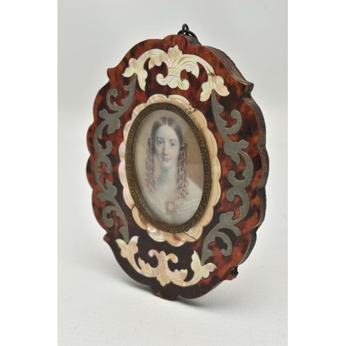 160 - A VICTORIAN HEAD AND SHOULDERS IVORY PORTRAIT MINIATURE OF A YOUNG WOMAN, her brown hair in ringlets... 