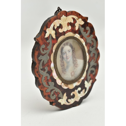 160 - A VICTORIAN HEAD AND SHOULDERS IVORY PORTRAIT MINIATURE OF A YOUNG WOMAN, her brown hair in ringlets... 