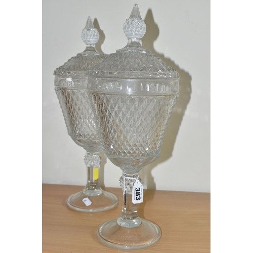 383 - A PAIR OF LATE 20TH CENTURY AMERICAN 'INDIANA GLASS' CLEAR PRESSED GLASS JARS AND COVERS OF CHALICE ... 